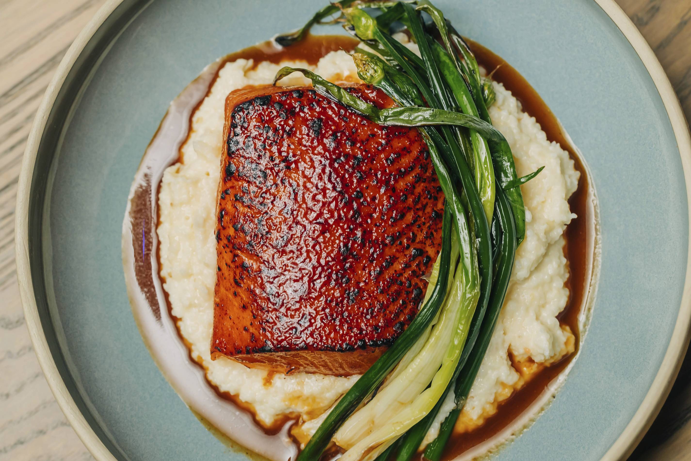 BBQ salmon with cheesy grits from the oakville in chicago