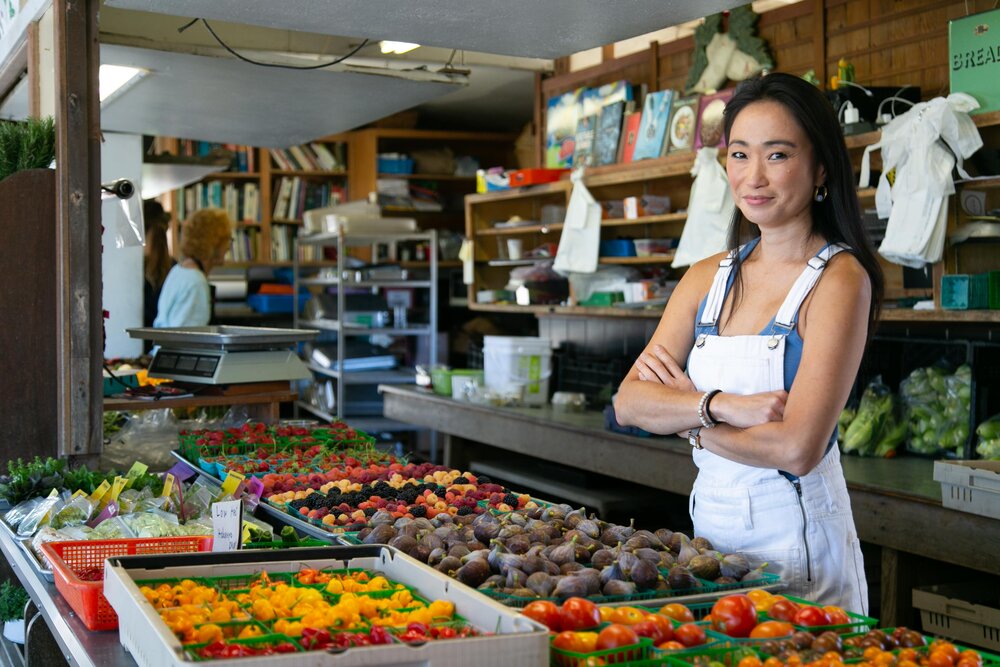 Danielle Chang poses in a food market
