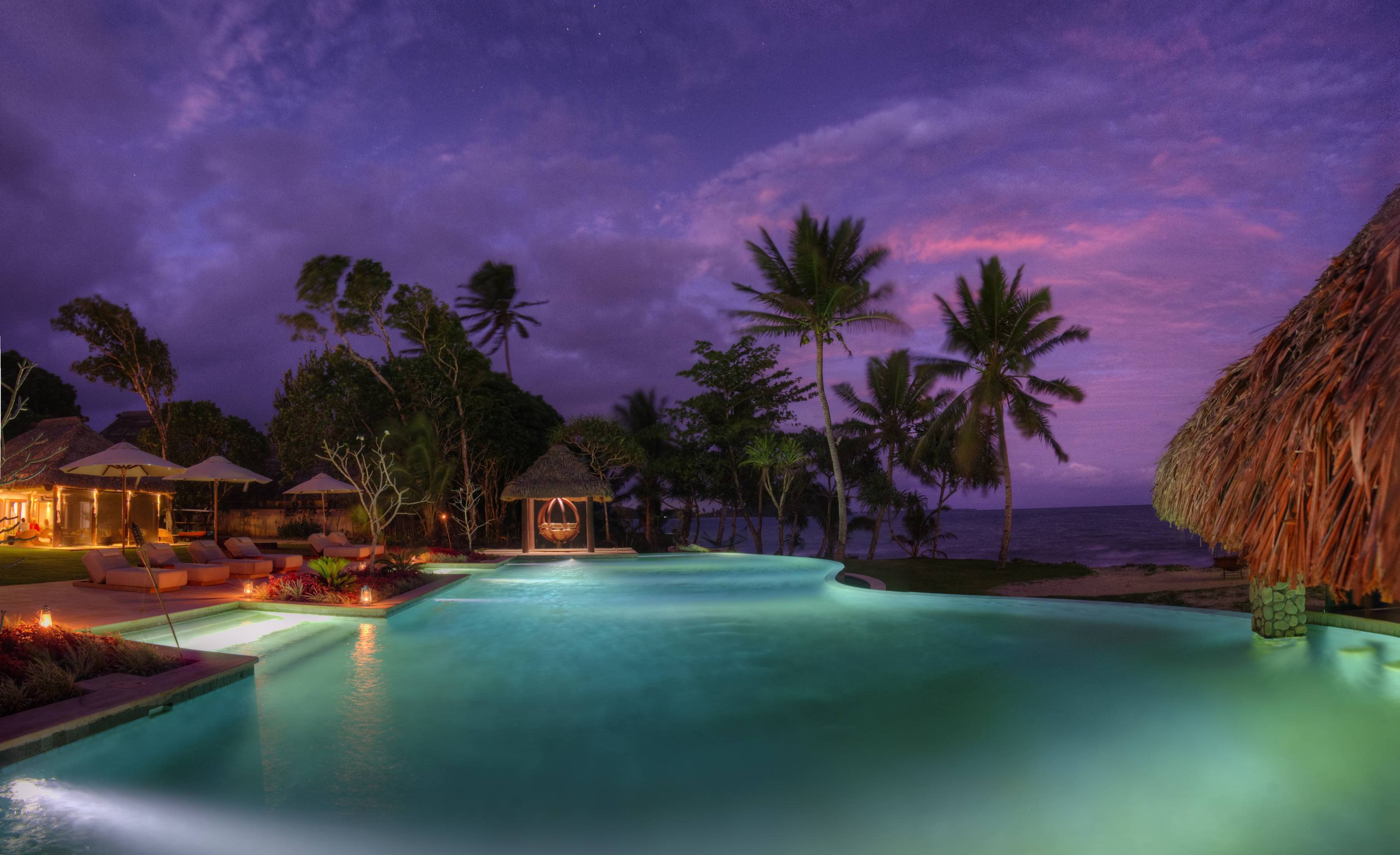 Resort_Magical_sunset_colours_at_Nanuku_across_the_Clubhouse_pool_and_pool_bar_Nanuku_Resort_Fiji_1.jpg