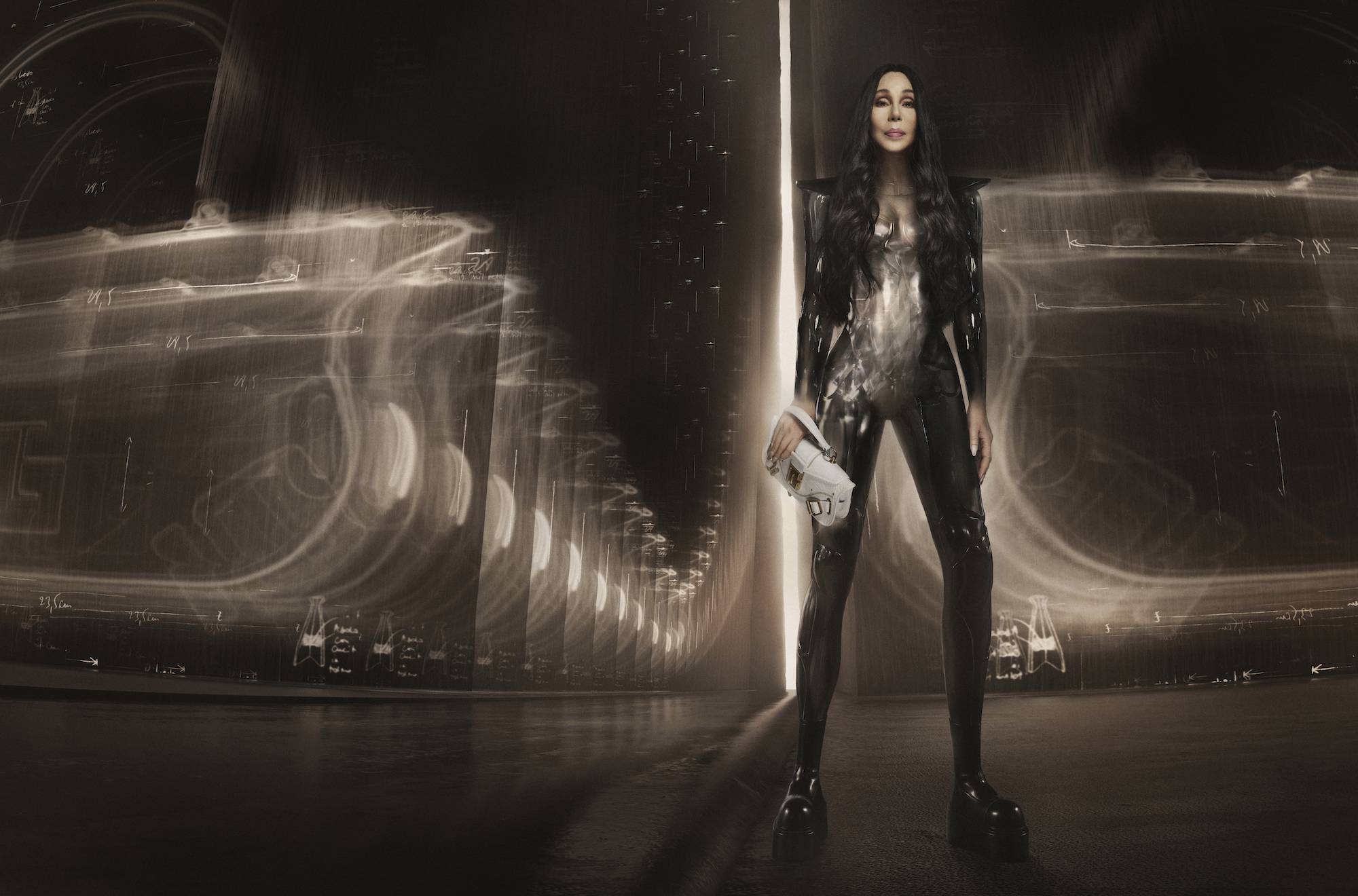 Cher poses as a superhero for Balmain's The Blaze bag collection 2022