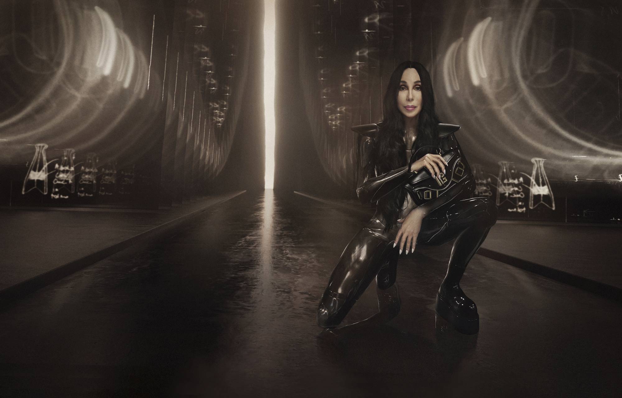 Cher poses as a superhero for Balmain's The Blaze bag collection 2022