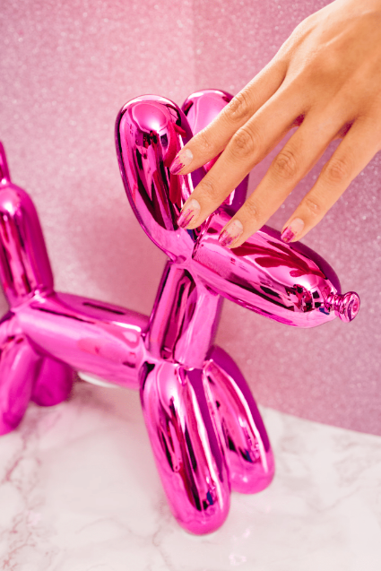barbie-inspired nail art design with pink foil