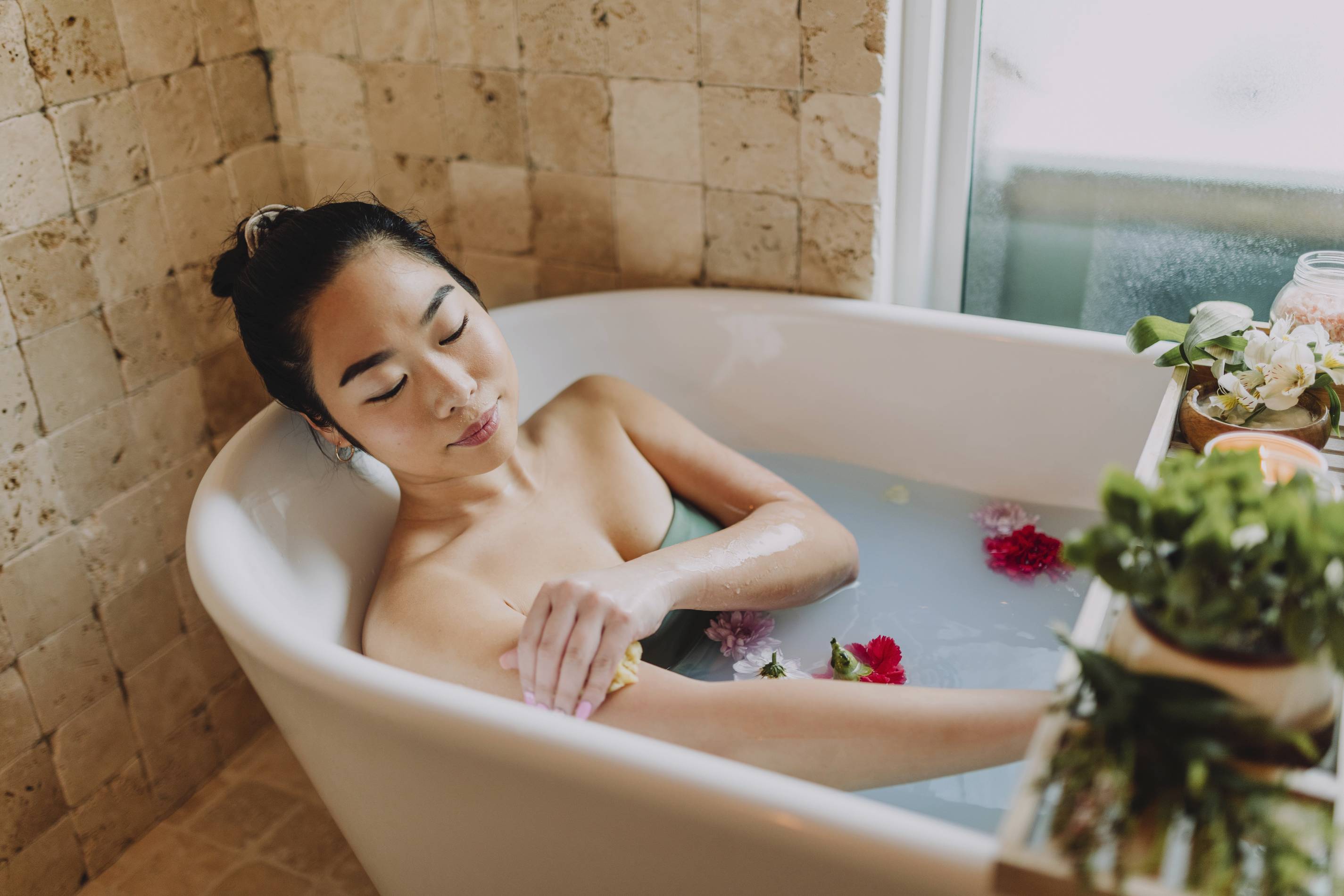 a woman enjoys a luxurious bath