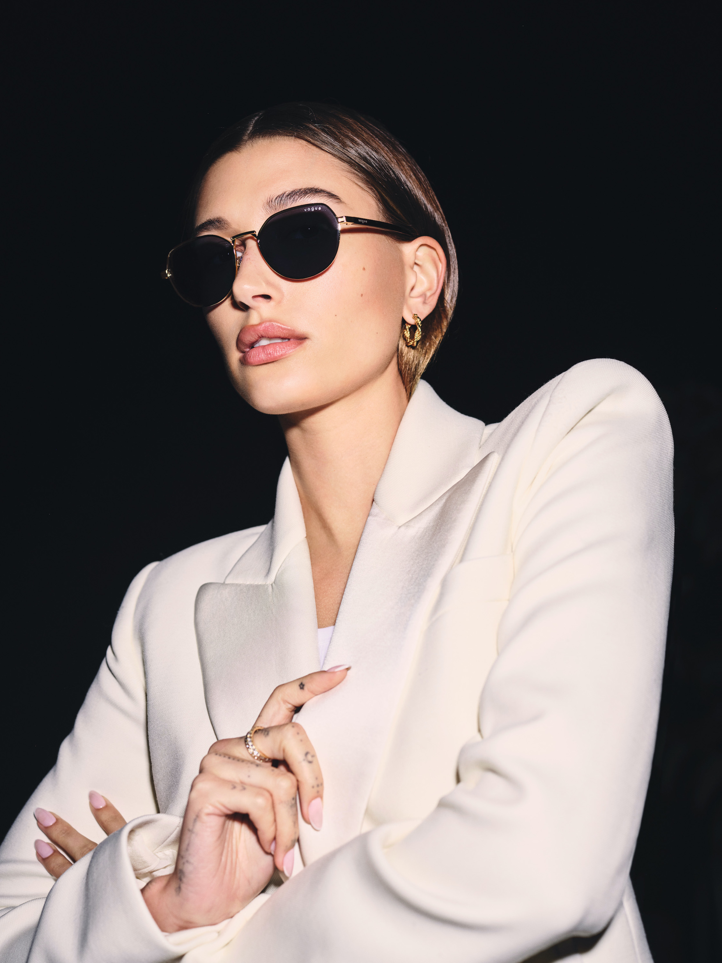 Hailey Bieber models her Vogue Eyewear collection