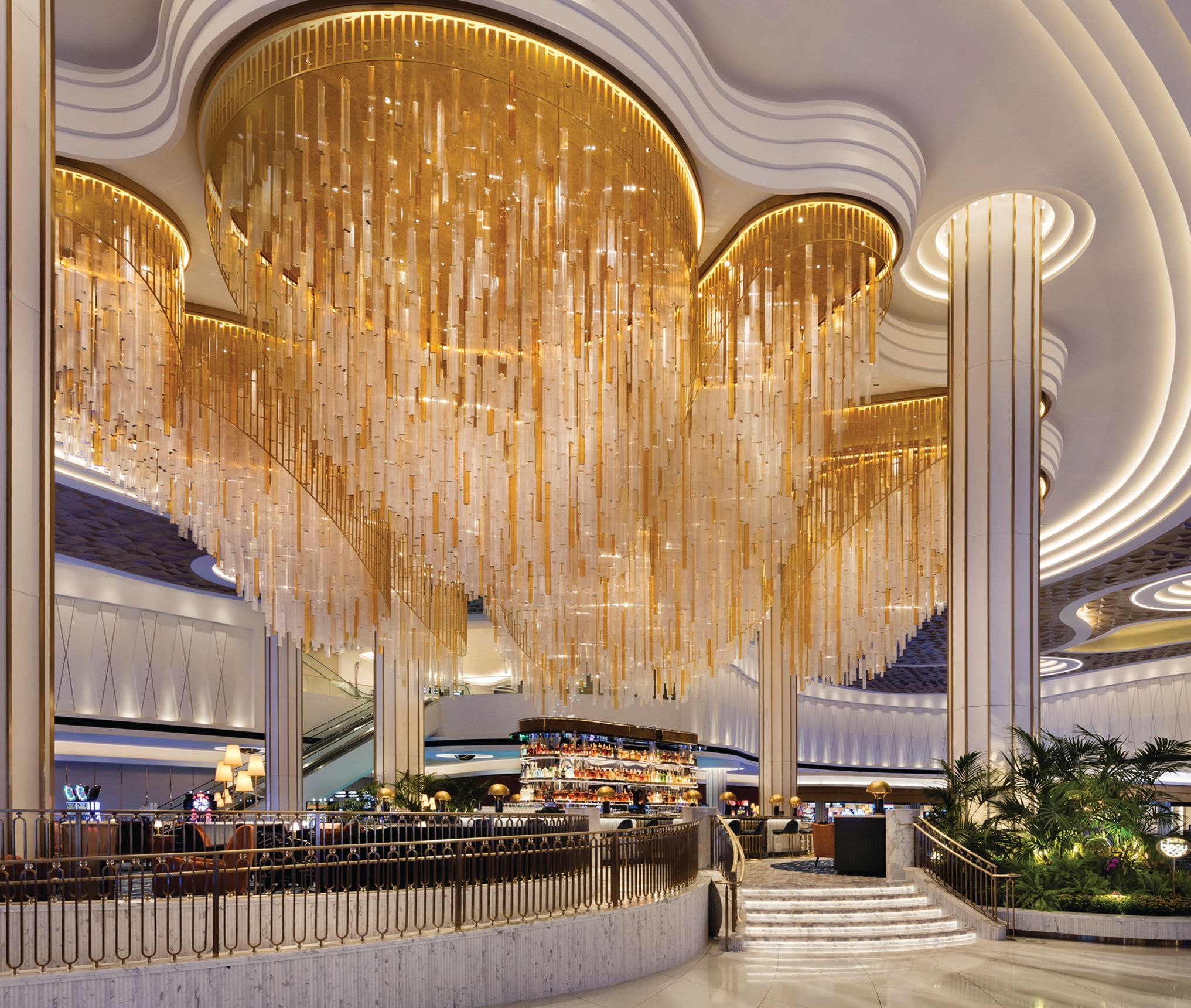 The beautiful Bleau Bar at Fontainebleau Las Vegas serves as the focal point of the casino floor. Its gilded chandelier features the resort’s signature bow tie motif at the bottom of each hanging column. PHOTO BY CONNIE ZHOU