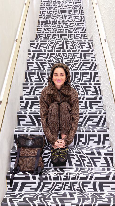 Artist Sarah Coleman amid a kaleidoscope of Fendi FF logos. PHOTO COURTESY OF BRANDS