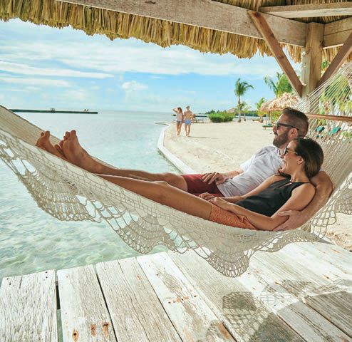 the private island is lined with hammocks, cabanas and more. PHOTO COURTESY OF TURNEFFE ISLAND RESORT