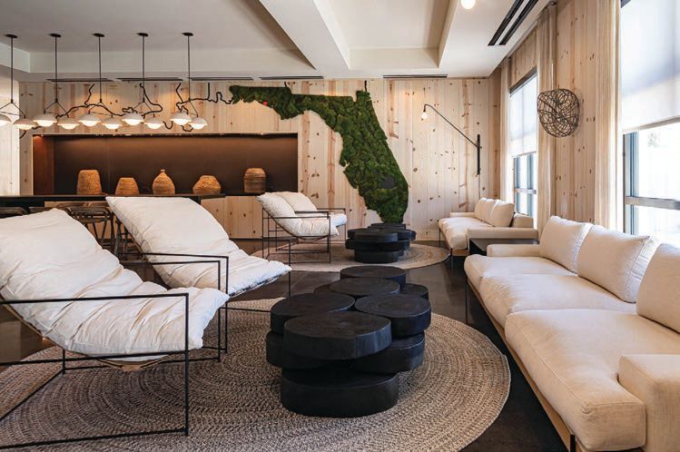 The lobby at The Lodge 30A beckons with
comfortable furnishings and an eye-catching green wall installation that nods to the setting. PHOTO COURTESY OF BRANDS