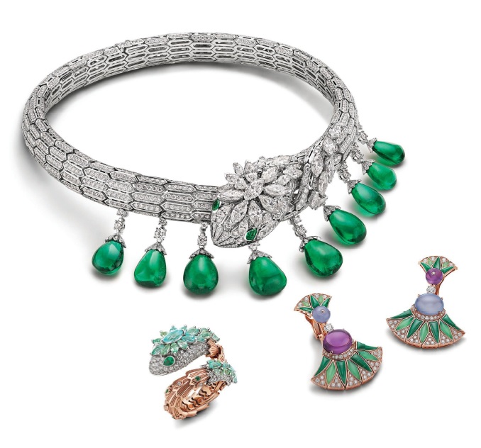 Clockwise from top: BVLGARI High Jewelry Serpenti necklace in white gold with nine emerald drops (66.39 carats), two pear emeralds (0.34 carat), 26 marquise diamonds (10.24 carats) and pavé-set diamonds (25.03 carats); BVLGARI High Jewelry Diva’s Dream earrings in pink gold set with malachite and chalcedony elements, two amethyst beads (9.01 carats), two chalcedony beads (8.57 carats), two round brilliant-cut diamonds and pavé-set diamonds (2.44 carats); BVLGARI High Jewelry Serpenti ring in pink and white gold set with 28 marquise brilliant-cut Paraíba tourmalines (2.74 carats), eight round and pear emeralds (0.25 carat) and pavé-set diamonds (1.54 carats). PHOTOS COURTESY OF BVLGARI
