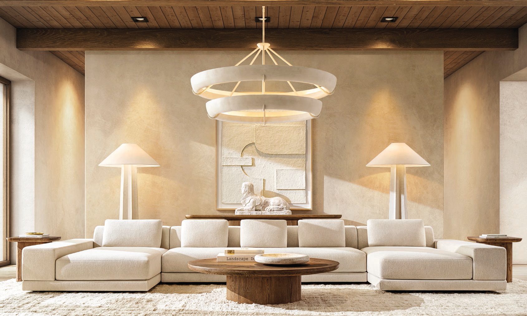 RH Contemporary Cortona sectional sofa and Seine Two-Tier round chandelier by Ryan Korban. PHOTO COURTESY OF BRAND