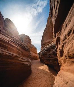 Slot canyons allow hikers to beat the heat as the towering rock faces provide shade. PHOTO BY TRAVIS BURKE