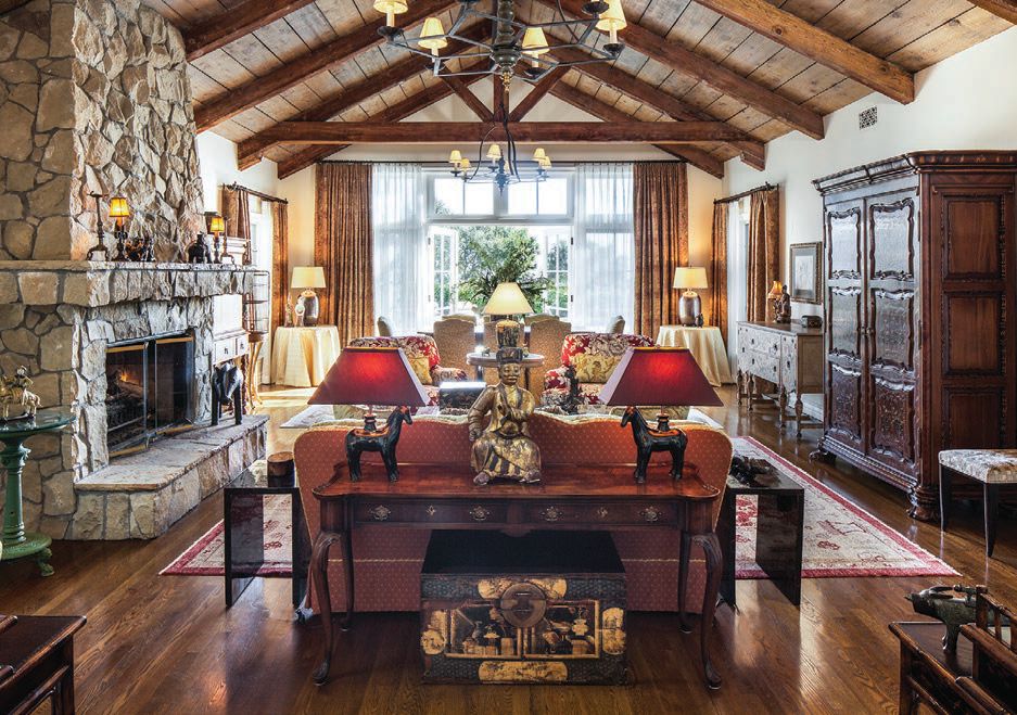 Hand selected antiques and a stone fireplace punctuate the European stylings of the Warner cottage’s grand entrance.  PHOTO COURTESY OF SAN YSIDRO RANCH