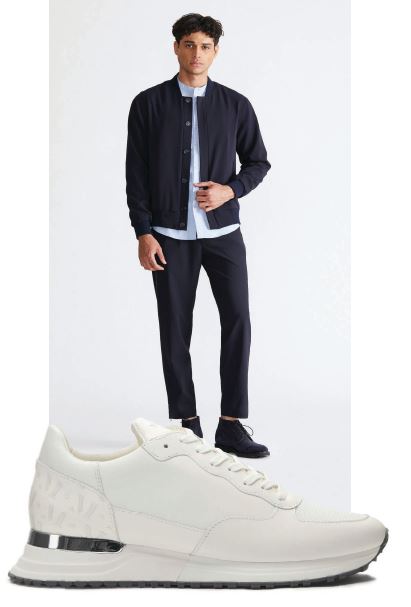“My signature look is a June79 navy Essentials Pierre blazer and Pierre trouser paired with a white banded collared shirt and my favorite go-to Mallet Popham sneaker in white,” says Pean; “Until My brand launches… Mallet London is the best sneaker in the world! But as I always say, there’s plenty of room at the table.” PRODUCT PHOTOS COURTESY OF BRANDS. 