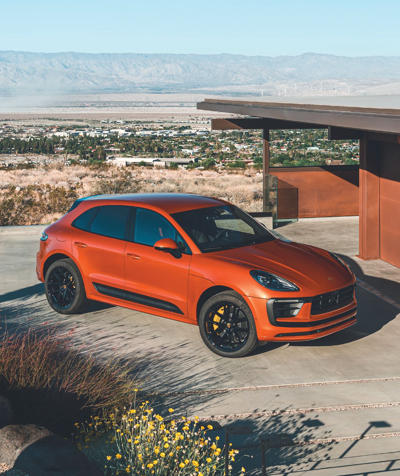 With Porsche Drive’s subscription program, members can get the latest Porsche models—like this Macan in striking Papaya metallic—delivered right to their door. PHOTO COURTESY OF PORSCHE