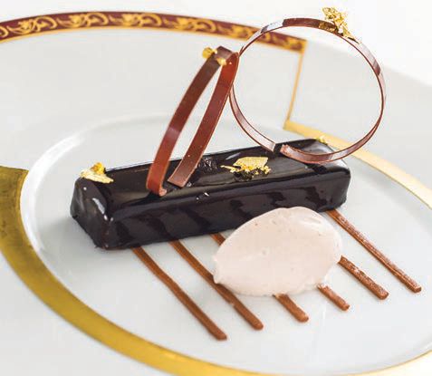 Louis XV, a French praline topped with milk chocolate mousse and dark chocolate glaze, is on the menu at Remy PHOTO BY MATT STROSHANE