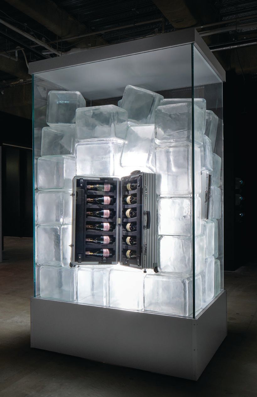 A Champagne-filled case “on ice” offers a playful twist PHOTO COURTESY OF RIMOWA FROM SEIT 1898 EXHIBITION
