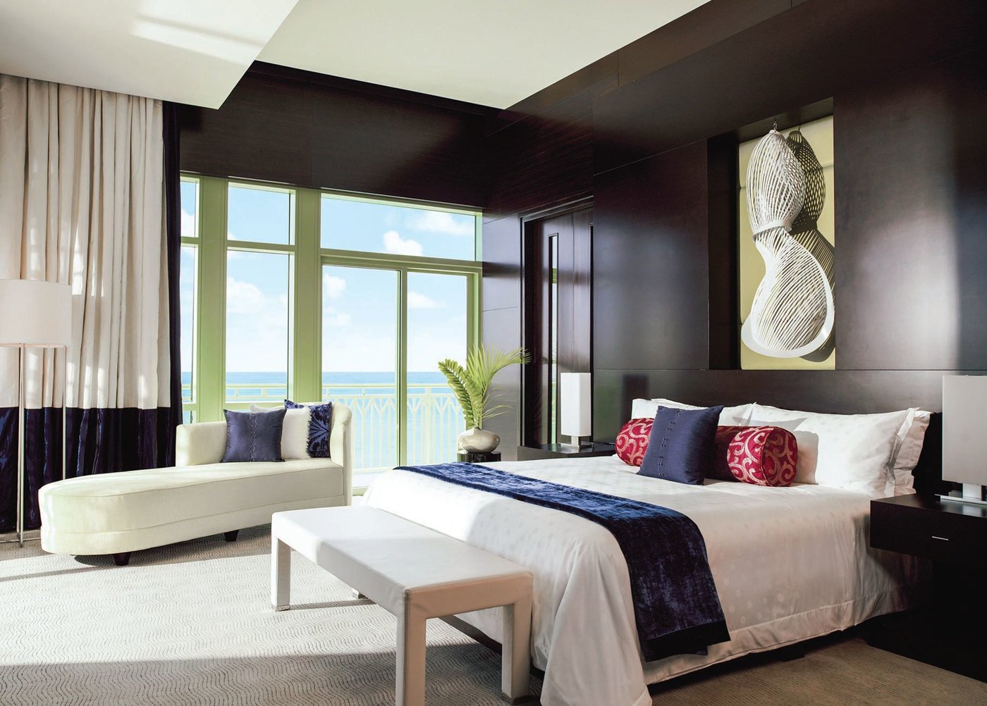 The Penthouse Suite’s primary bedroom offers stunning water views. PHOTO COURTESY OF BRAND