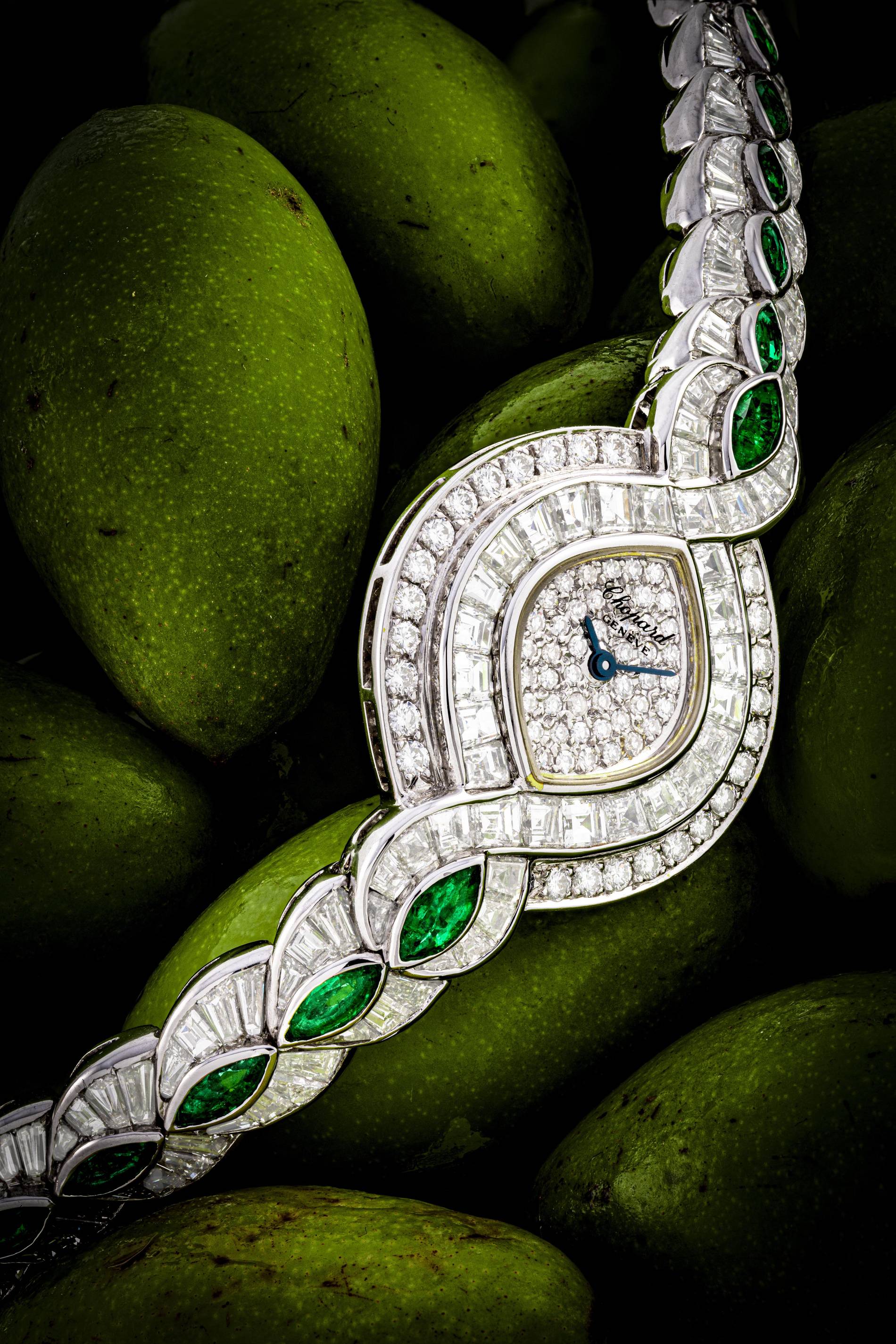 Haute Joaillerie white gold Chopard bracelet watch set with diamonds and emeralds