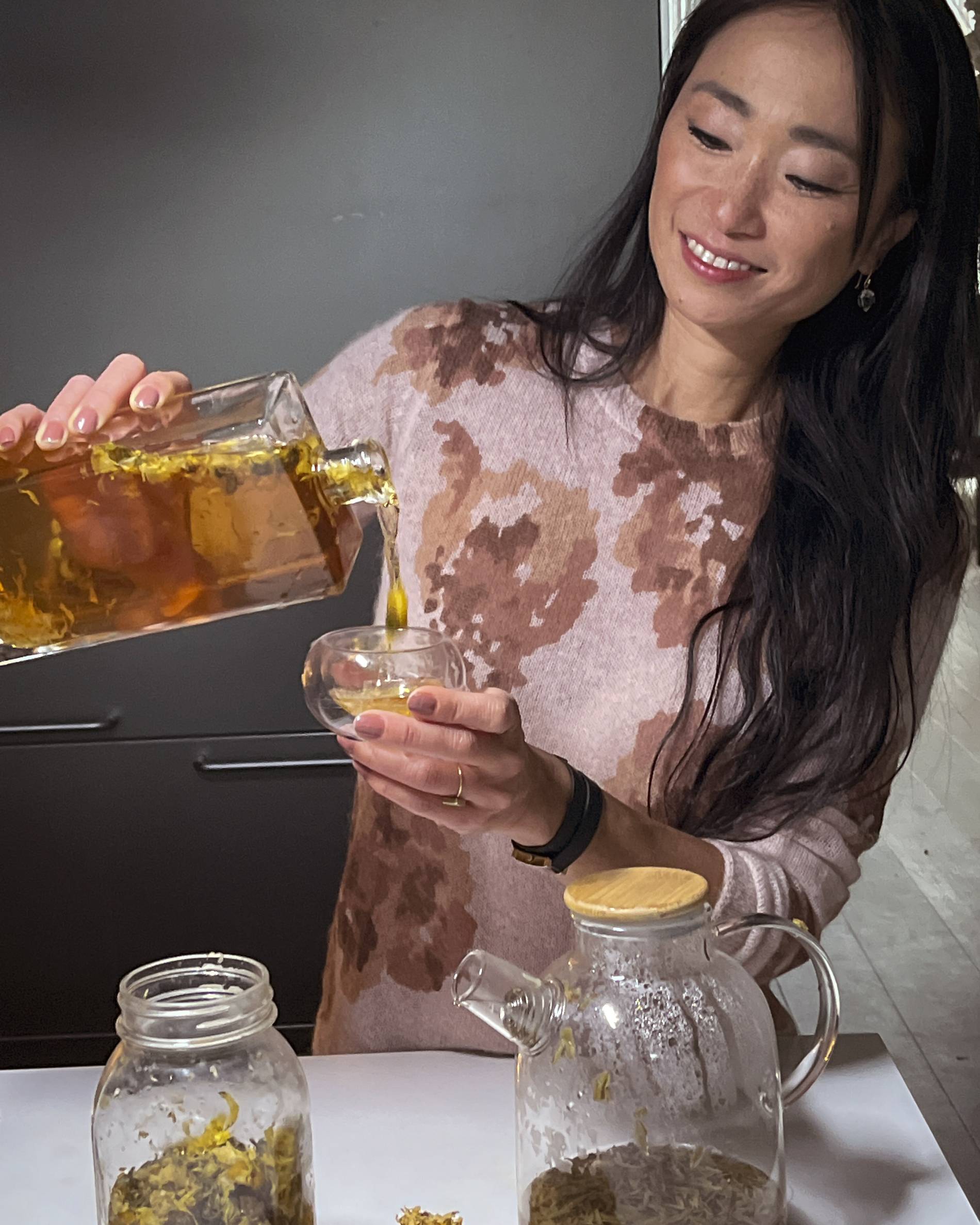 Danielle Chang pouring home-brewed tea