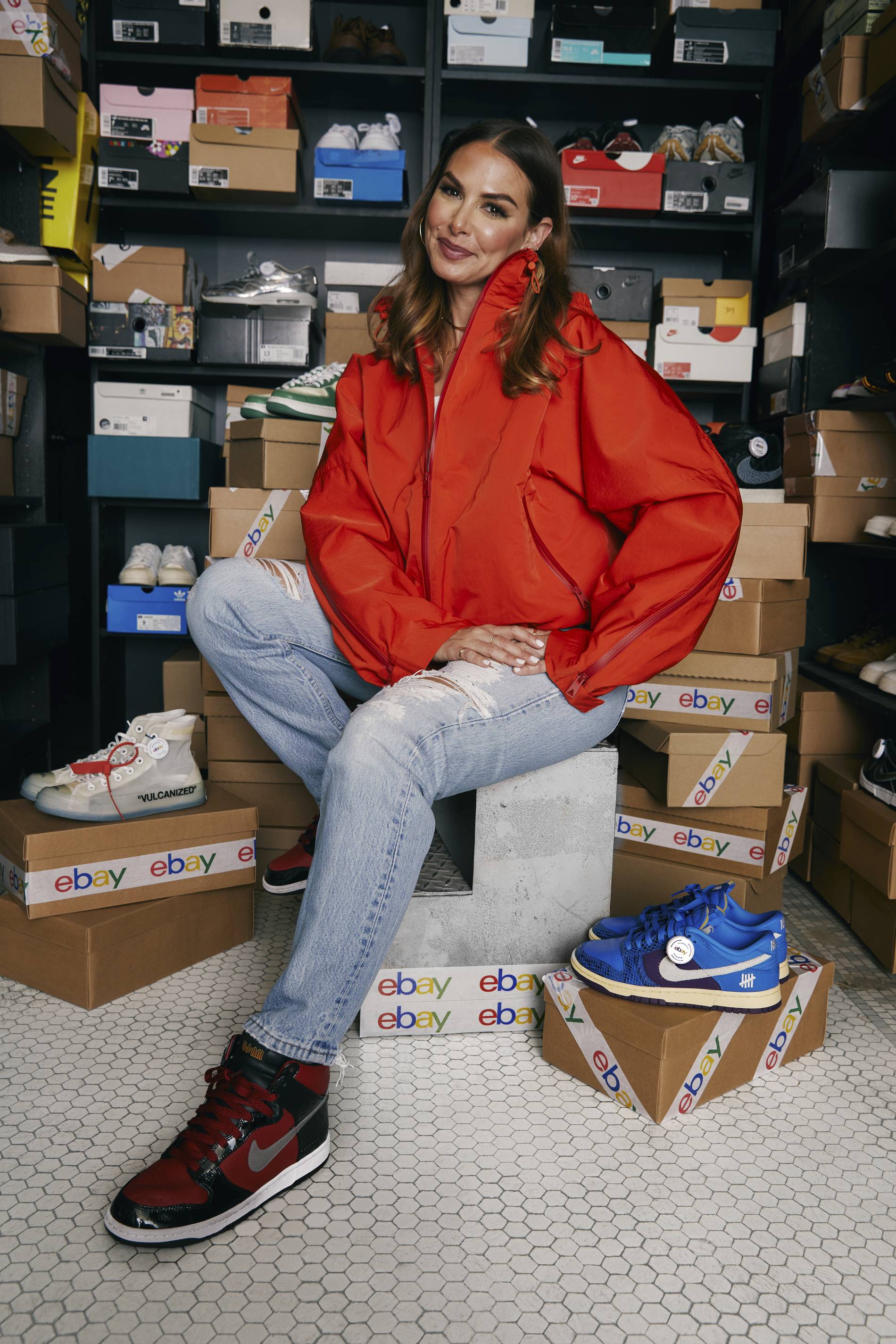 Joy Claire poses with her sneaker collection, going up for auction on eBay