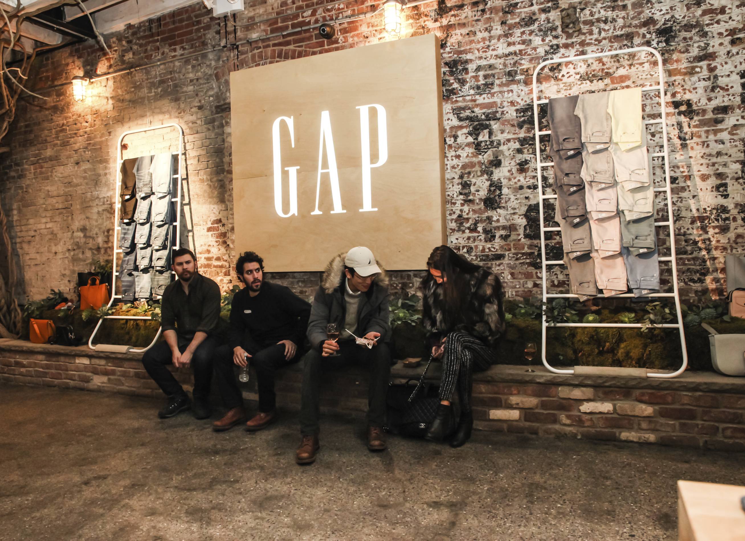 people huddle at an event hosted by Gap