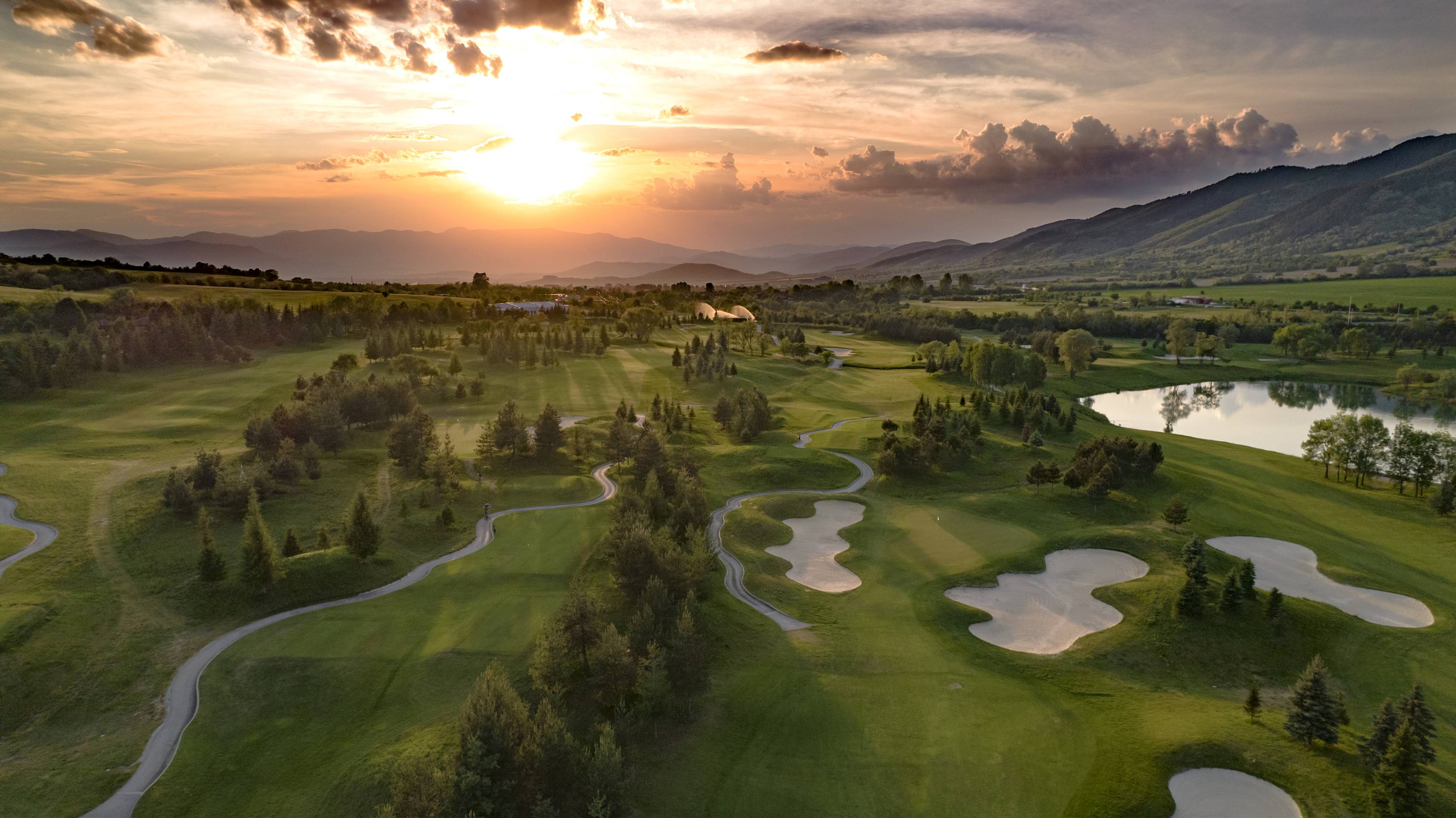 a golf course at sunset