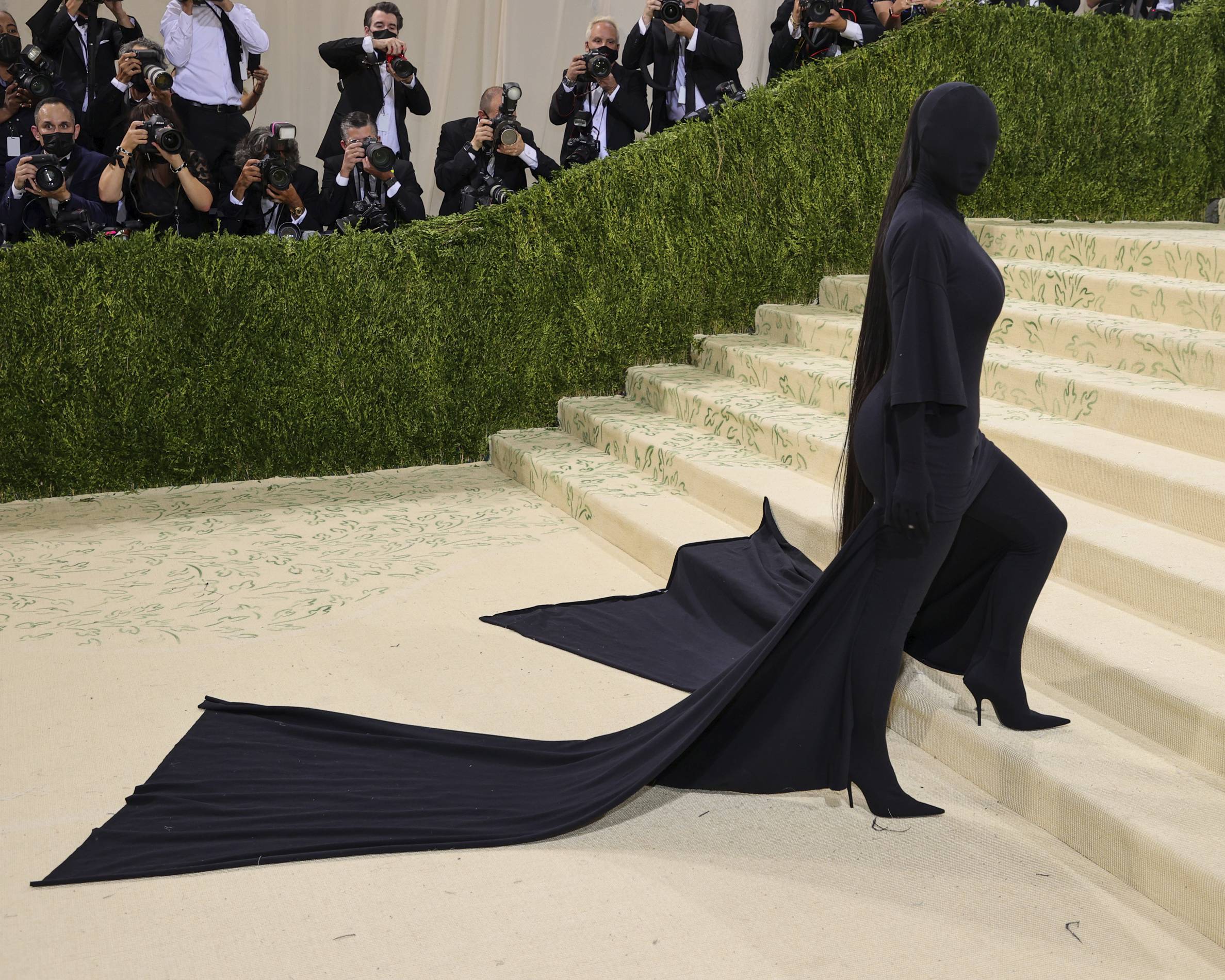 Kim Kardashian walks the Met Gala red carpet.
