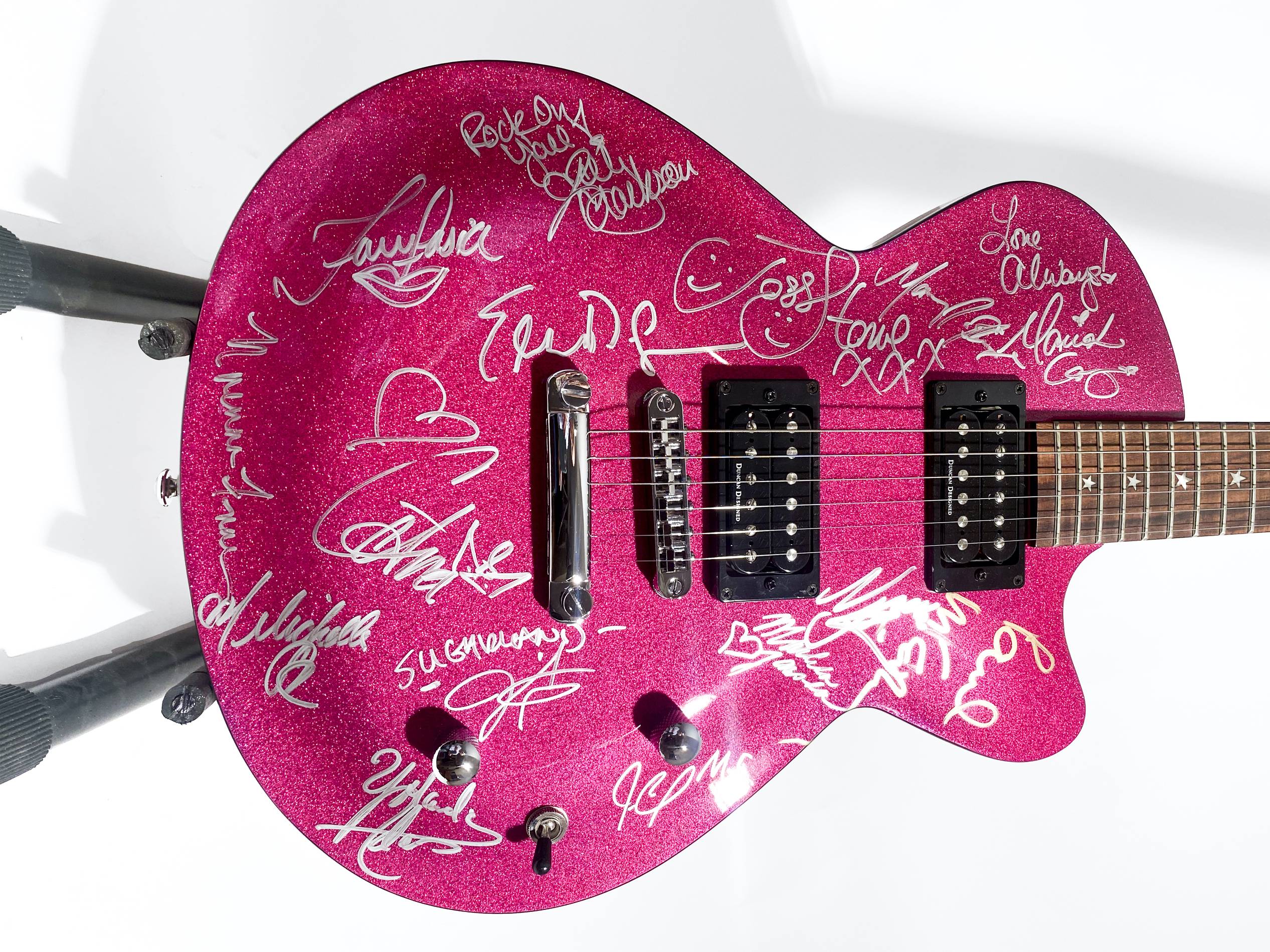 music-grammy-guitar-main.Daisy Rock Guitar autographed at the 2006 Grammys by Paul McCartney, Mariah Carey, Mary J. Blige, Nicole Kidman and Keith Urban. This auction also includes several guitars played by Paul McCartney