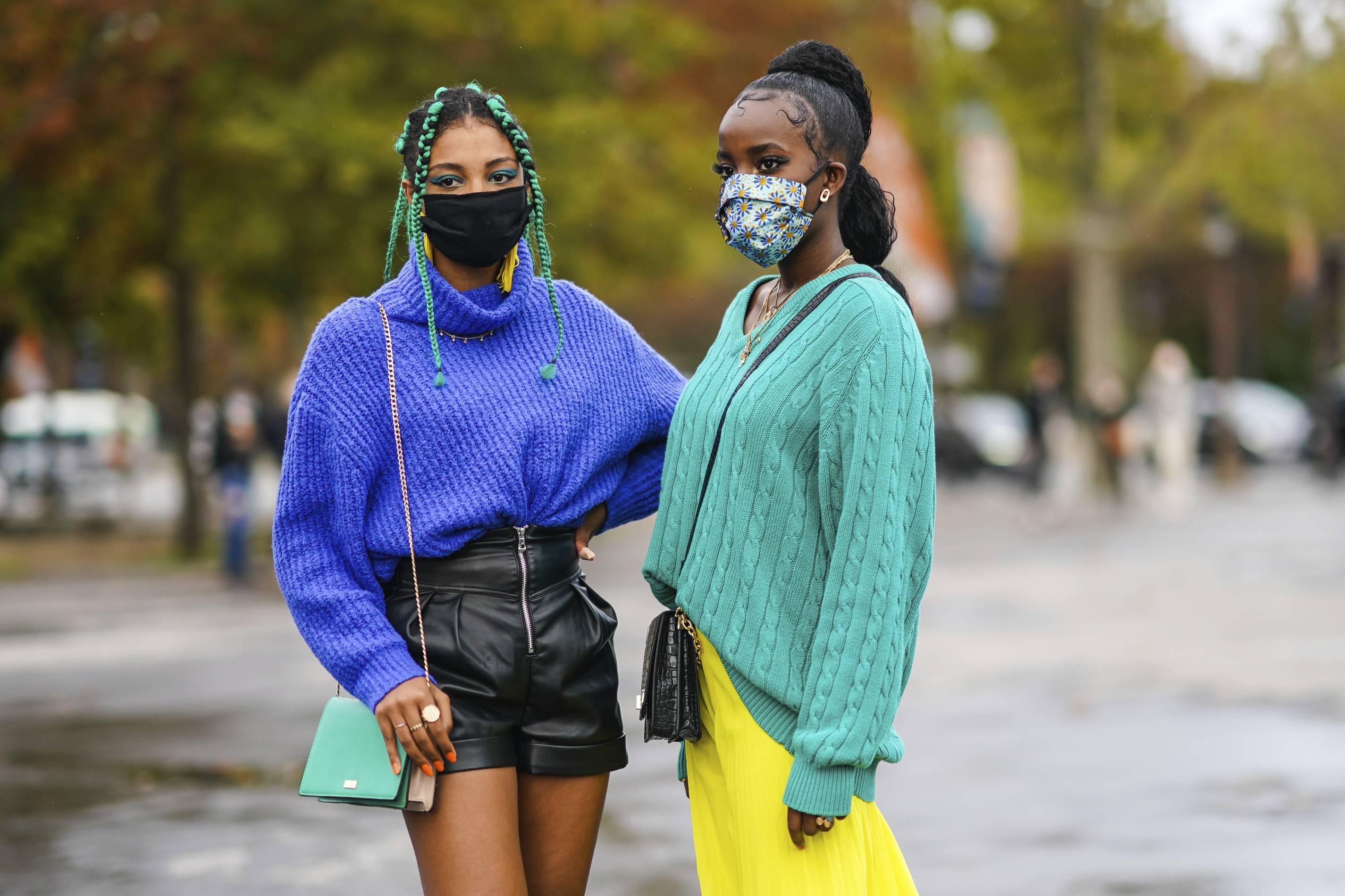 Women at Paris Fashion Week wearing face masks