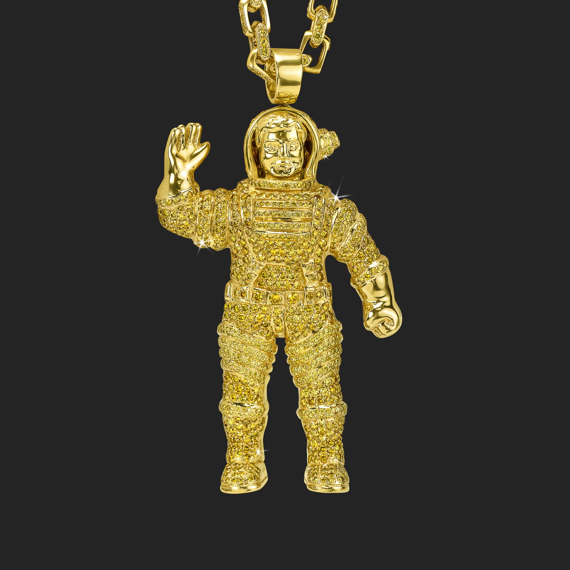 pharrell williams' gold astronaut pendant necklace