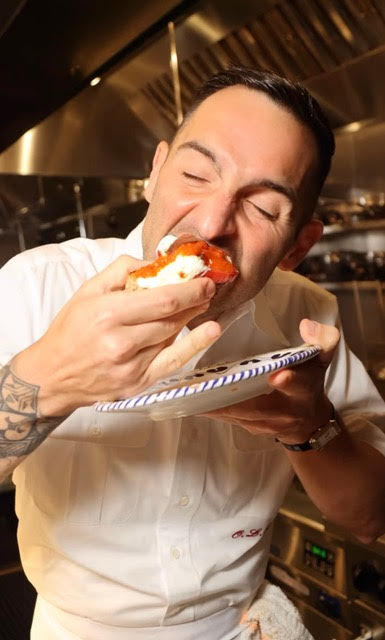 Mario Carbone enjoys his pizza toast