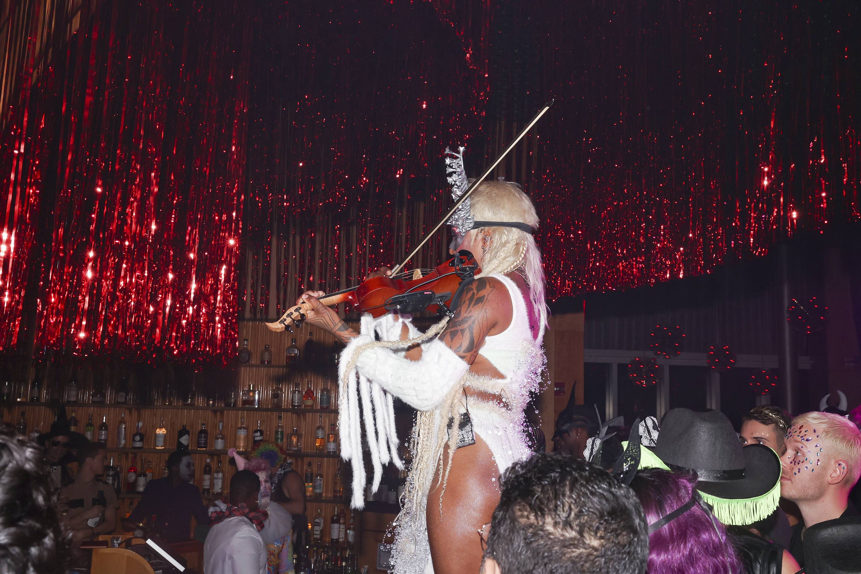 sudan archives plays violin while performing at the standard halloween party 2022