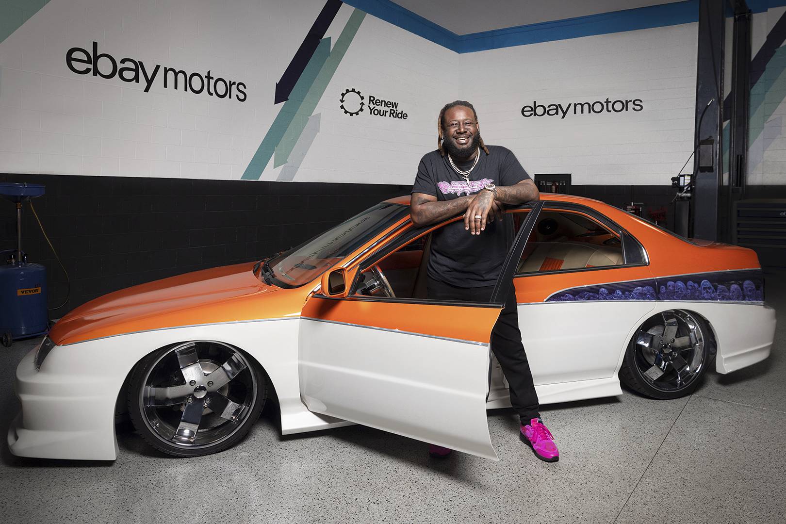 t-pain poses with his tricked-out 1994 honda accord in the ebay motors garage