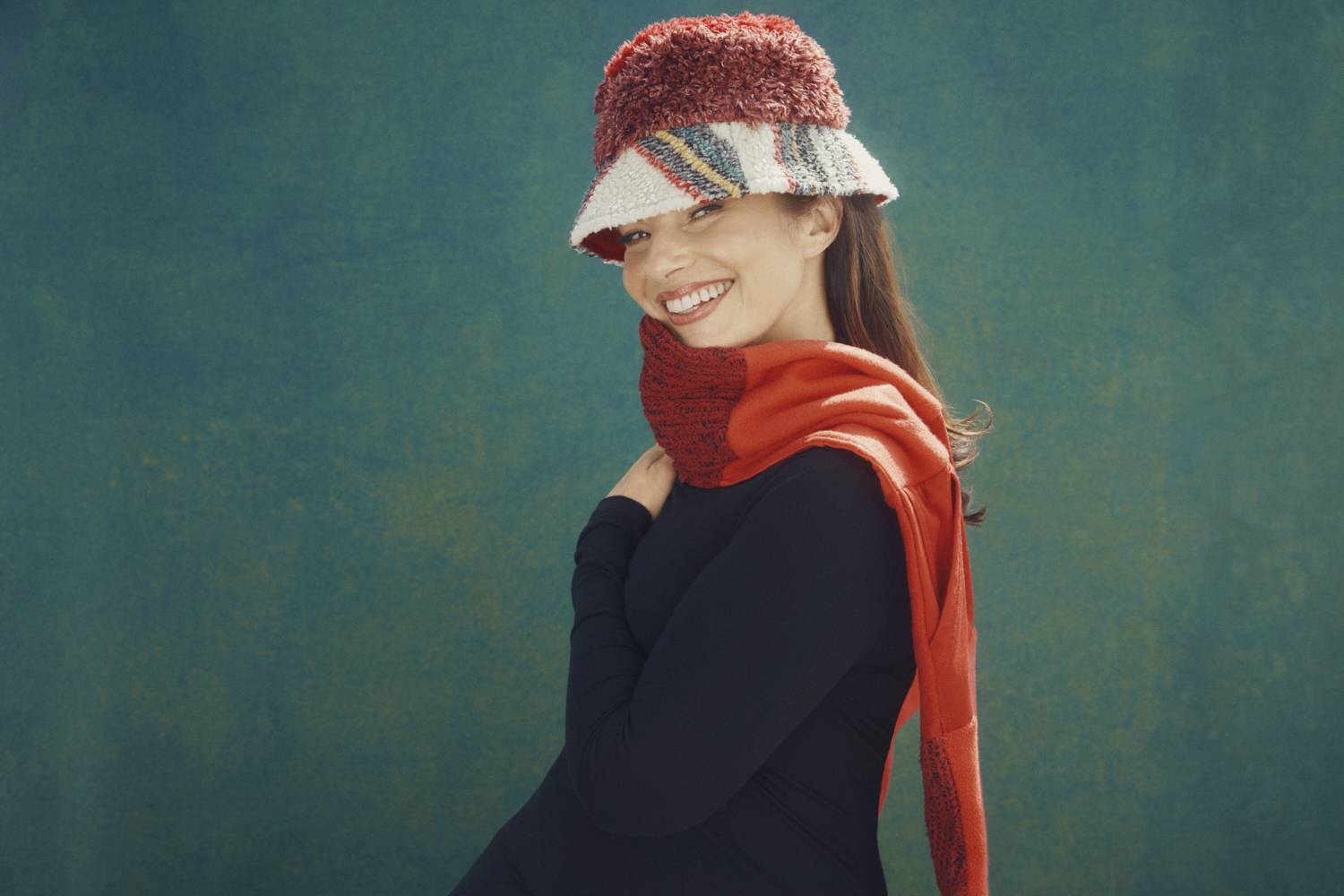 Fran Drescher in a bucket hat and scarf from ThredUp holiday collection 2022