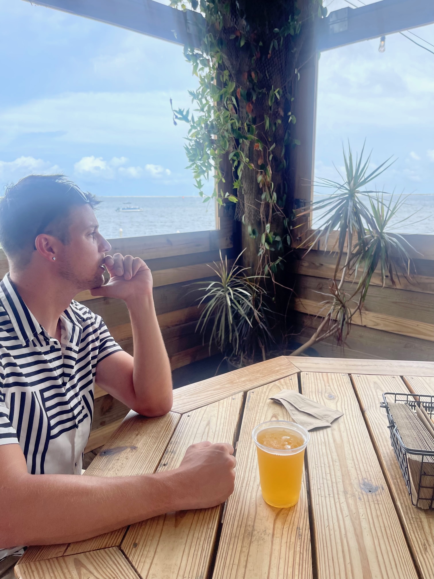 tyler regan enjoys a beer on the Atlantic coast