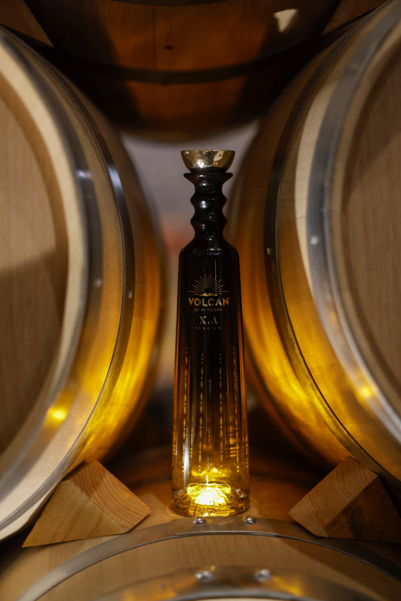 Volcán X.A. bottle in the barrel aging room